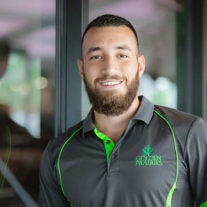 man smiles in his uniform